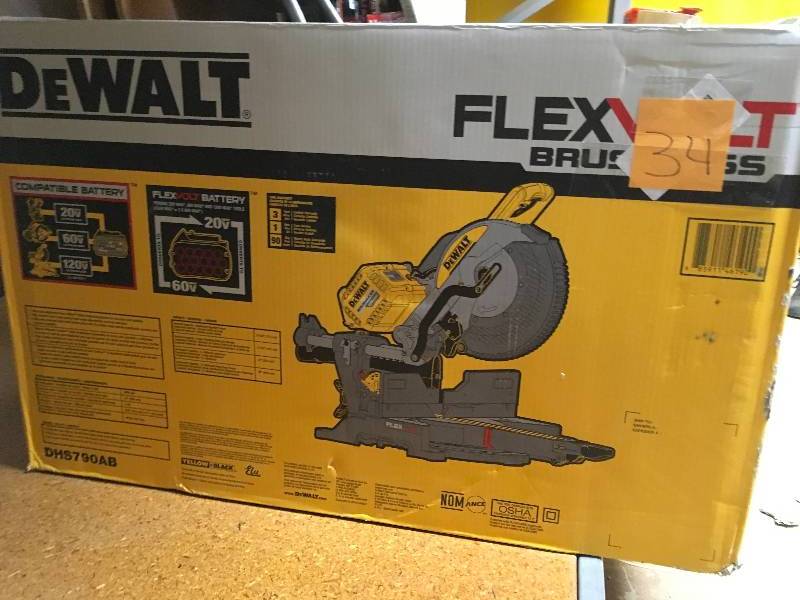 lot 34 image: Dewalt DHS790AB 120V MAX FLEXVOLT Cordless Lithium-Ion 12 in. Sliding Compound Miter Saw with Adapter Only (Bare Tool) not used