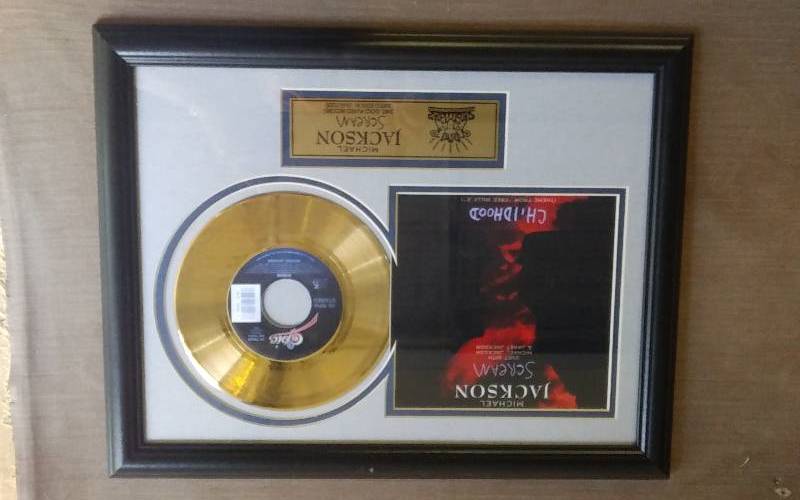 lot 11 image: Michael Jackson Scream Limited Edition, #26463000 24 Kt Gold Plated Record 14x18