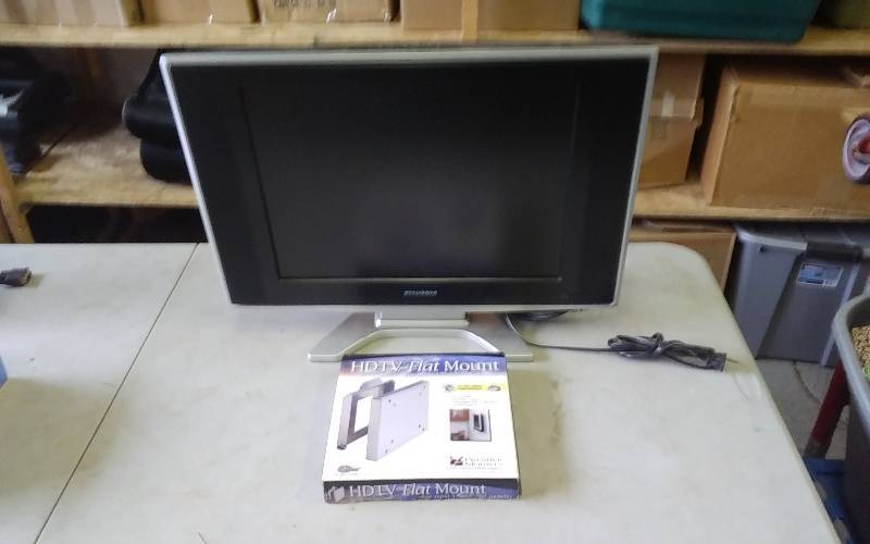 lot 30 image: Sylvania 20 Inch LCD TV With Remote Model SSL2006 & 17-40 Inch Flat Mount