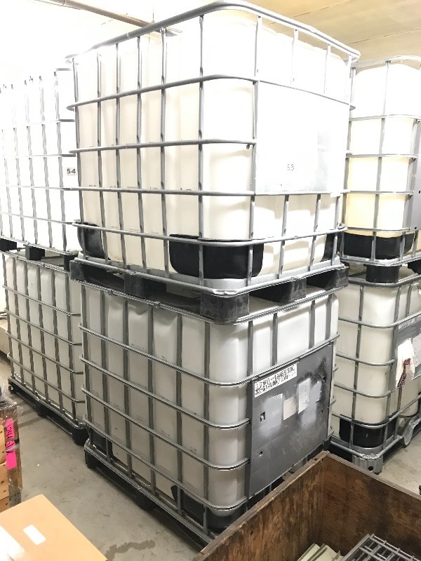 2 POLY FLUID TANKS WITH SPIGOTS  VALVES