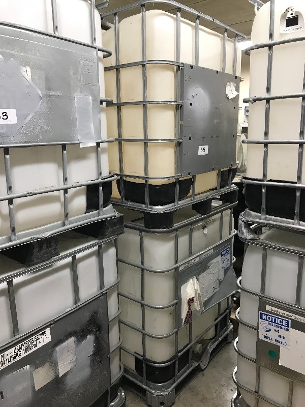 2 POLY FLUID TANKS WITH SPIGOTS  VALVES