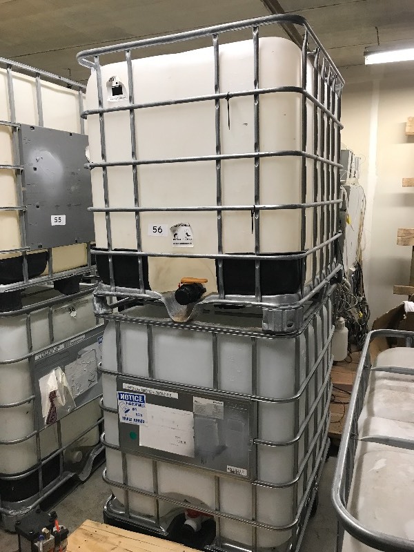 2 POLY FLUID TANKS WITH SPIGOTS  VALVES