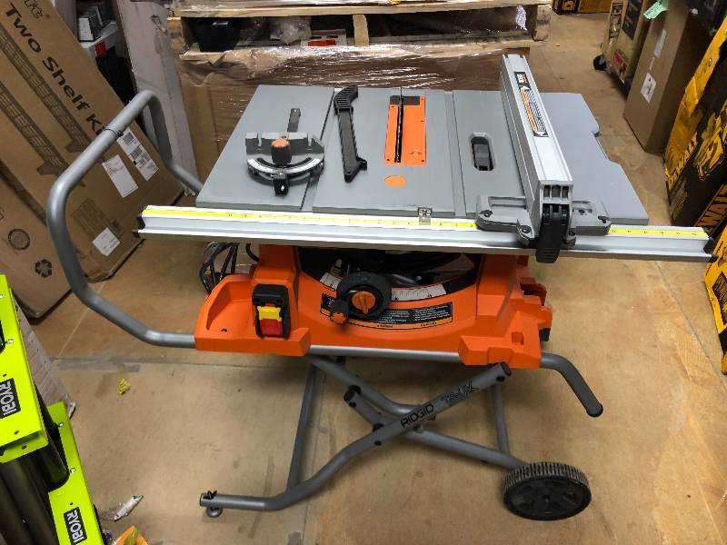 RIDGID 15 Amp 10 in. Heavy-Duty Portable Table Saw with Stand Model#  R4513 in working conditions