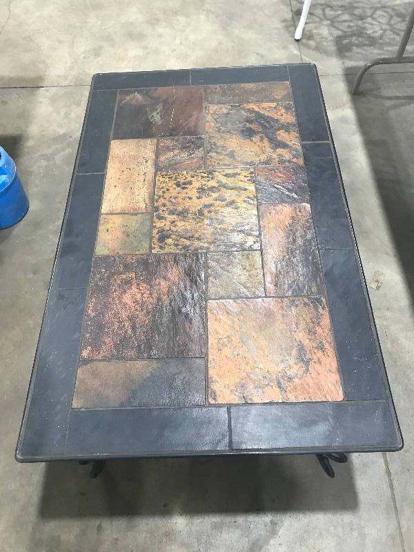 lot 99 image: Stone tiled patio table