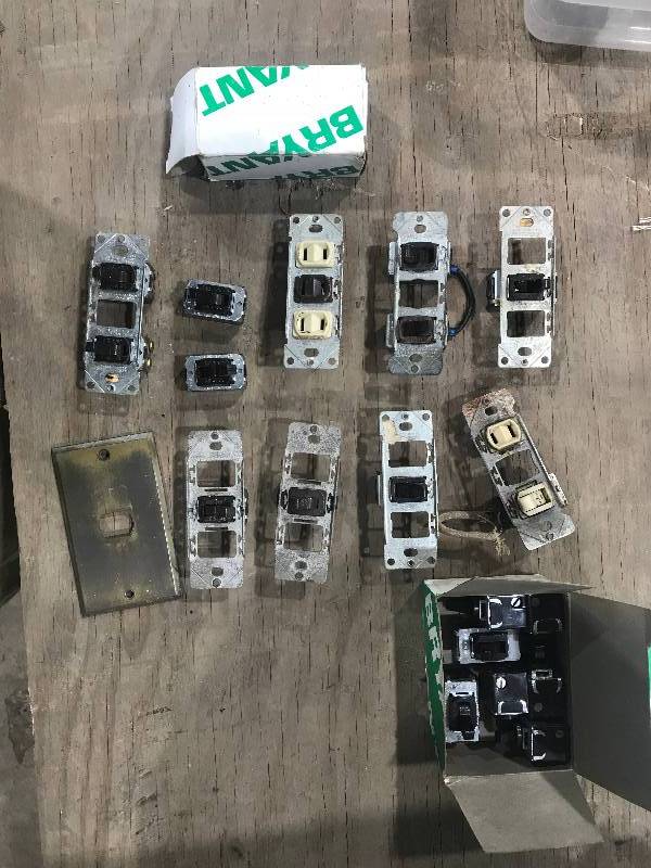 lot 102 image: Jumper cables, parts bin, wall outlets and switches