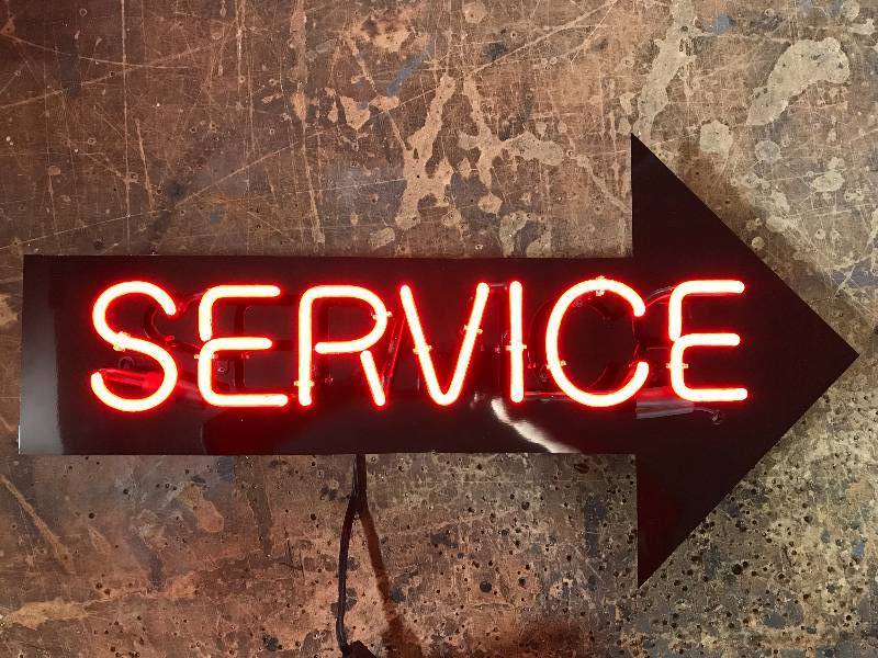 lot 127 image: Neon service arrow