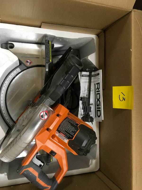 lot 13 image: RIDGID 15 Amp 10 in. Dual Bevel Miter Saw in good condition