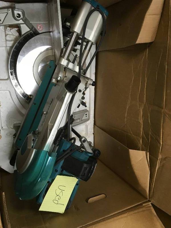 lot 20 image: Makita 15 Amp 12 in. Corded Double Bevel Sliding Compound Miter Saw with Built In Laser, No Blade, Dust Bag in working conditions