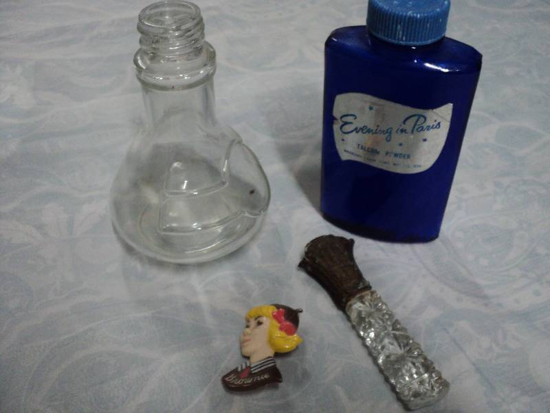 lot 35 image: perfume bottles and brownie pin...