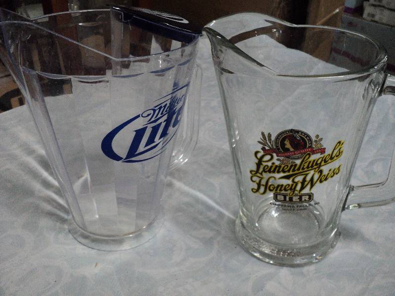 lot 49 image: 2 beer pitchers, 1 plastic 1 glass...