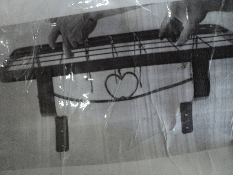 lot 73 image: red metal rack and 2 place settings...