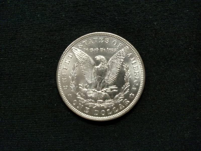 1884 AU Morgan Silver Dollar...