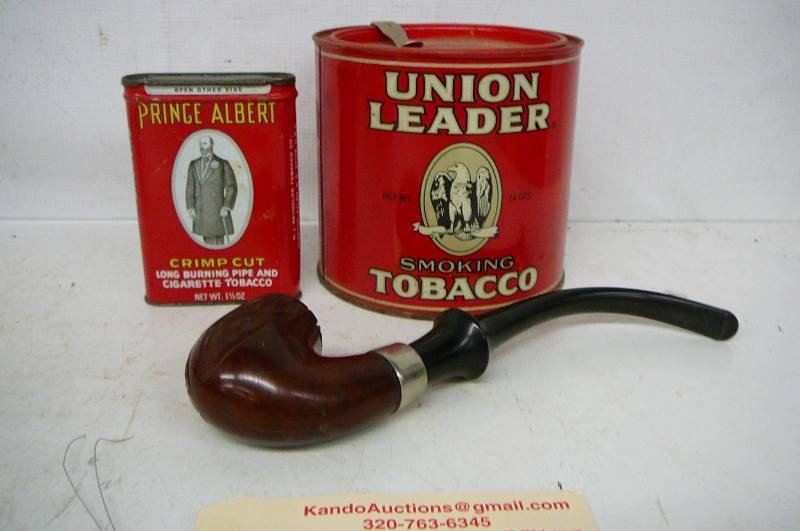 lot 136 image: Tobacco tins & Pipe