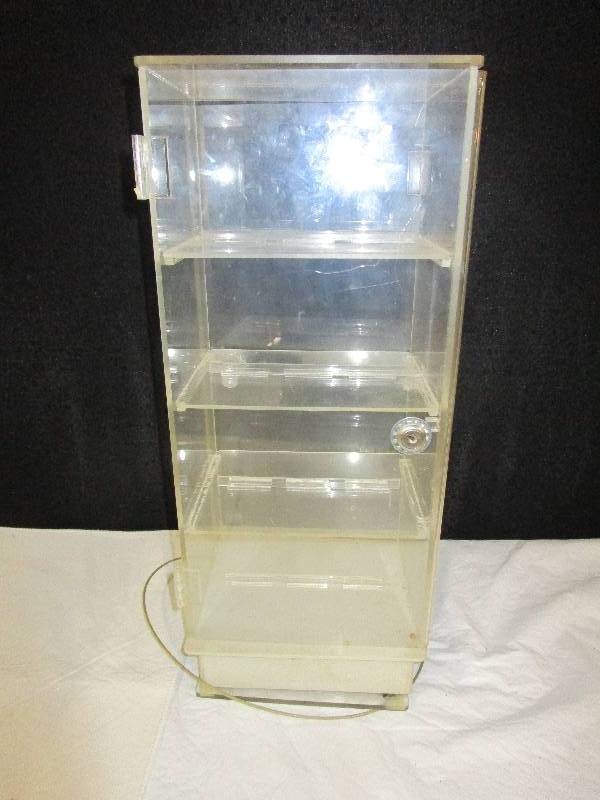 lot 80 image: Plastic display case, no key, doors on both sides. 20.5 high 6.5 wide and 8.5 long