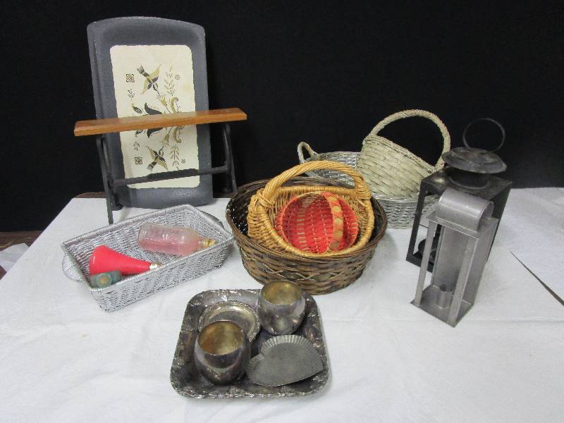 lot 99 image: castiron paper towel holder, assortment of wooden baskets, class bottles, plastic trays, medal trays, lanterns