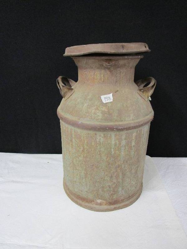 lot 102 image: Old cream can 21.5 high