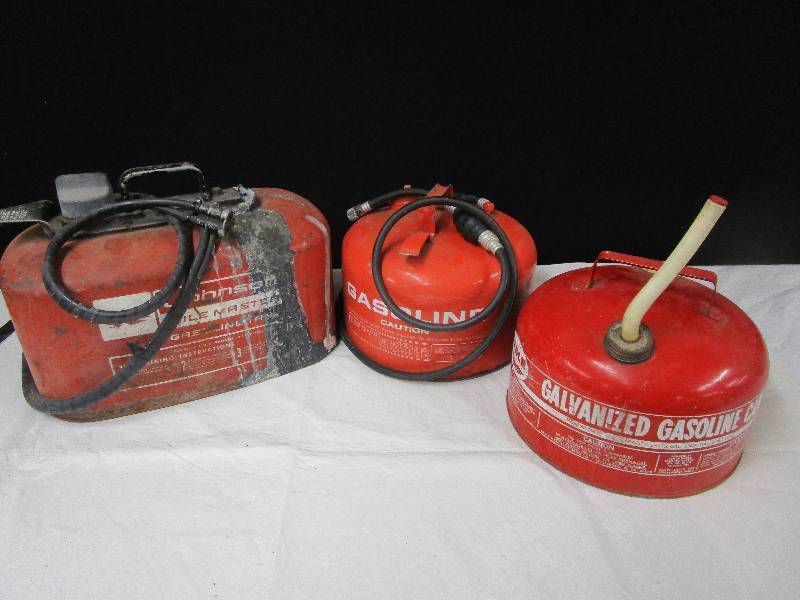lot 134 image: Johnson Boat Motor Tank, another Boat Tank and Eagle Gas can