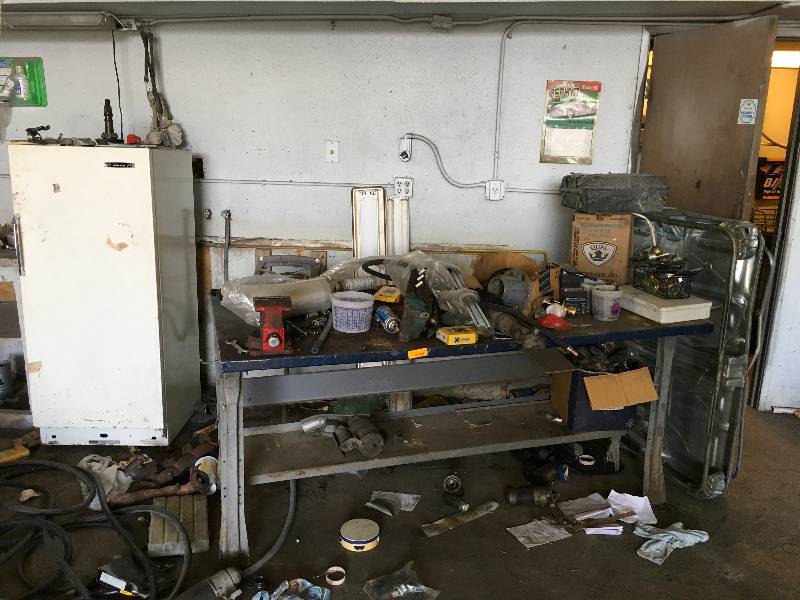 lot 134 image: Fridge, Battery Acid, Metal Shelf wcontents, Hose, and Lights