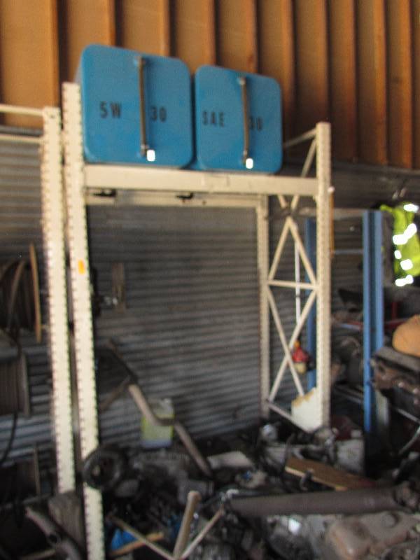 lot 154 image: METAL RACKING WITH TWO BLUE OIL TANKS ON TOP
