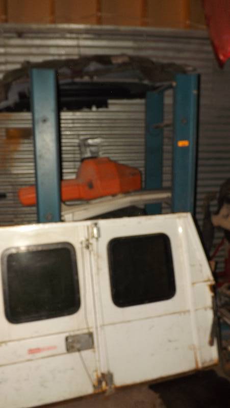 lot 228 image: BLUE ENGINE RACK, REAR DOORS FOR WORK TRUCK, CHAIN SAW CASE - EMPTY, AND MISC ITEMS