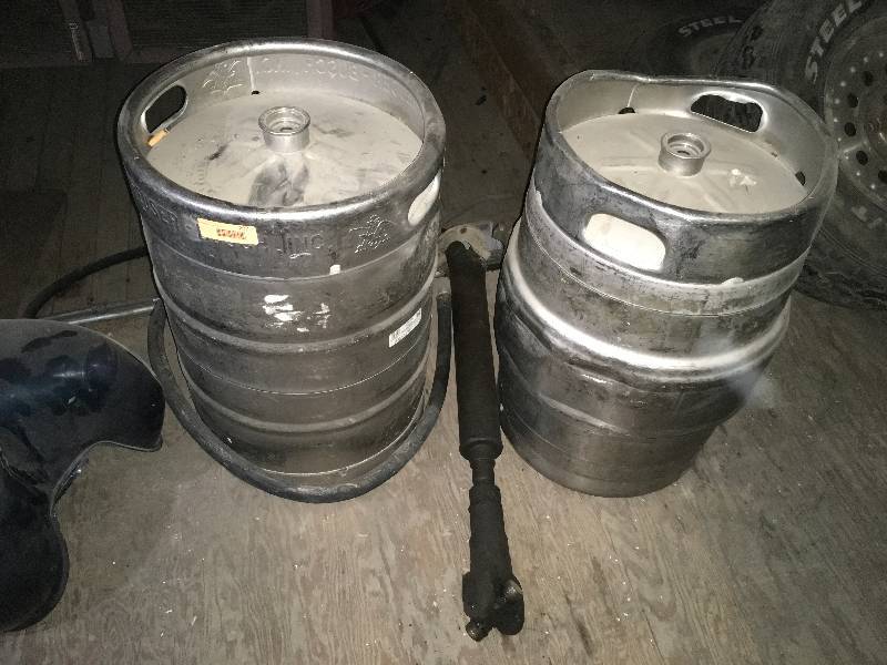 lot 207 image: TWO BEER KEGS AND A DRIVE SHAFT
