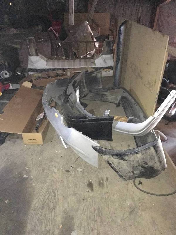 lot 242 image: BUMPERS AND MISC CAR PARTS
