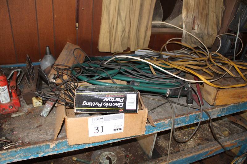 lot 31 image: Oscar Jr. Electric Putting Partner, Bottle Jack, Punch Set, Extension Cords, And More