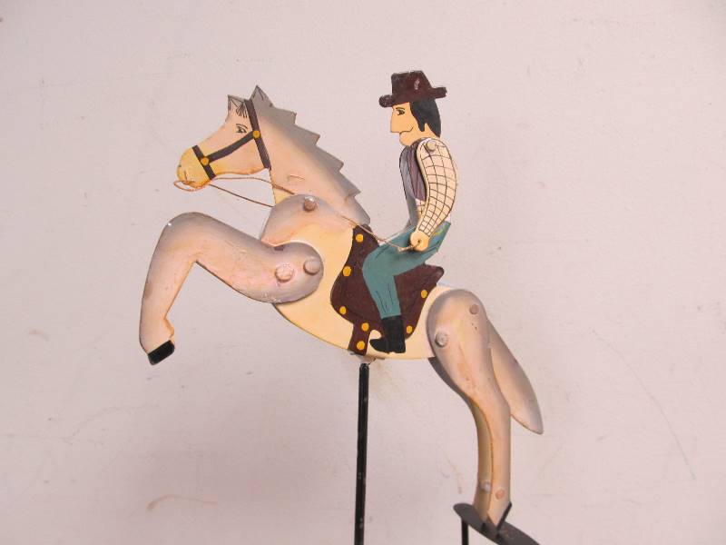 lot 13 image: Hand Painted Metal Balancing Cowboy 