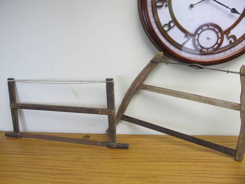 lot 23 image: Pair of Antique Buck Saws