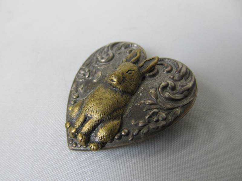 lot 184 image: Antique Sterling Silver Rabbit on Heart Brooch