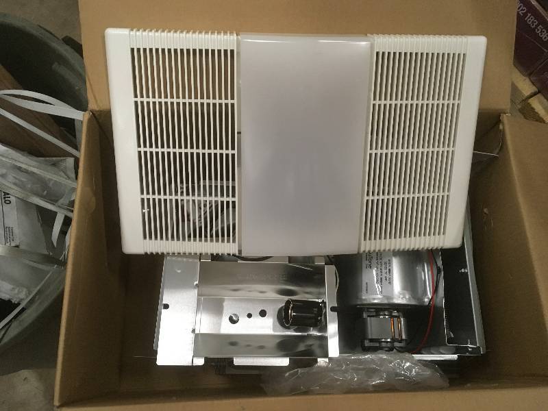 lot 34 image: Nutone 70 CFM Ceiling Exhaust Fan with Light and 1300-Watt Heater in like new condition
