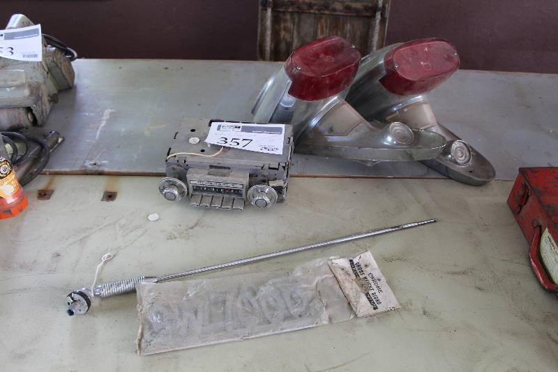 lot 357 image: 1957 Oldsmobile Parts - AM Radio, Decal, Tail Lights