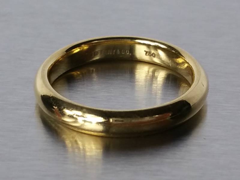 lot 13 image: Tiffany and Co. 18k Yellow Gold Band  $1000 Retail
