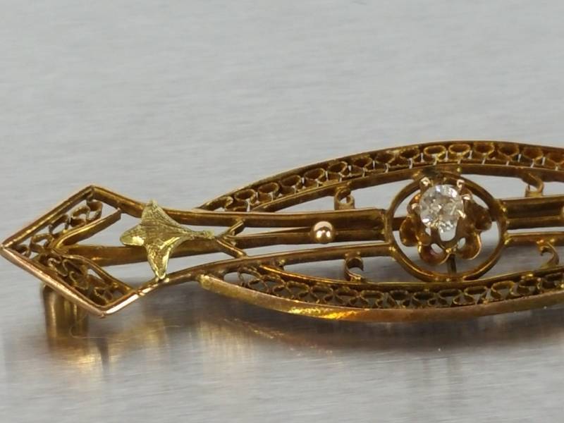 lot 24 image: Antique Victorian Diamond and Gold Filigree Pin