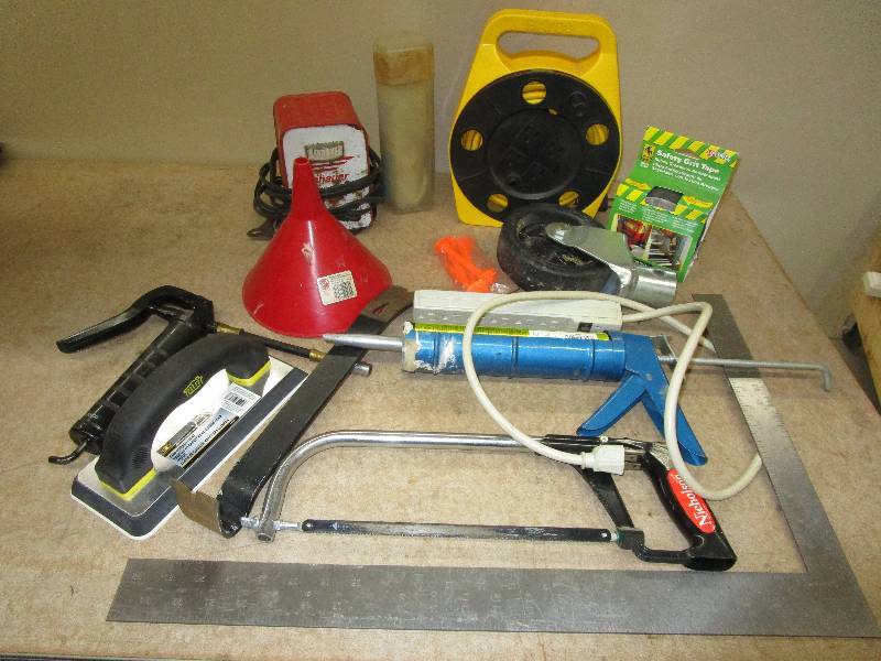 Battery Charger, Funnel, Electric Chord on Reel, Grease Gun and Various Items