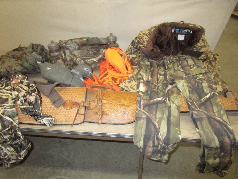 Xlarge Prairie Mountain Camo Coat, Rain Coats, Orage Hats, Camo Suplly Belt with Water Bottles and More. Kids Large Pants, And Leather Gun Case needs a little Repair