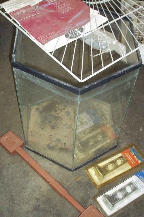 lot 21 image: Closet corner shelf,2 flag holders, fish tank not sure on size