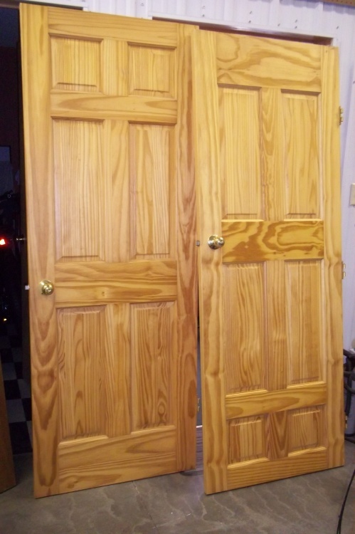 lot 31 image: 2 - 6 panel solid doors, 1 hollow core door. All doors are 30 inches wide.