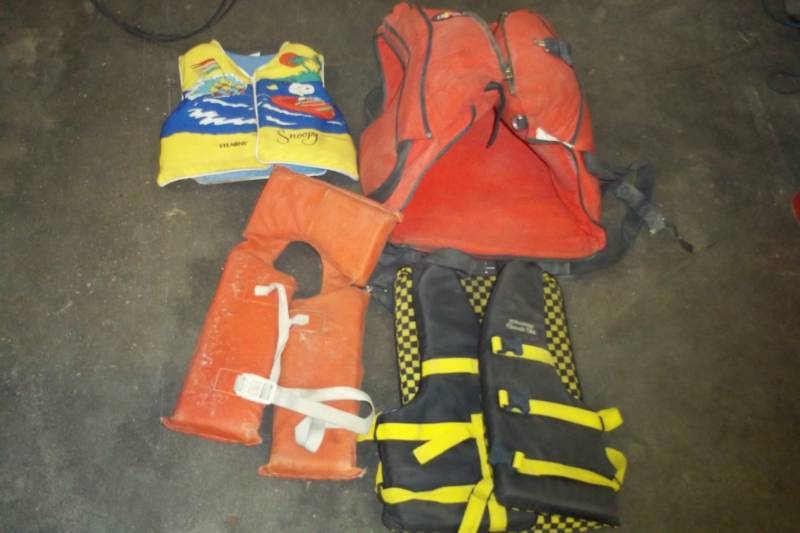 lot 77 image: Assorted life jackets including old Coast Guard style.
