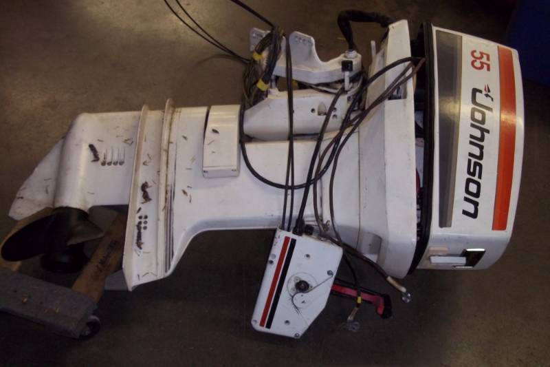 lot 3 image: 55 hp Johnson outboard. Electric start, tilt and trim controls.