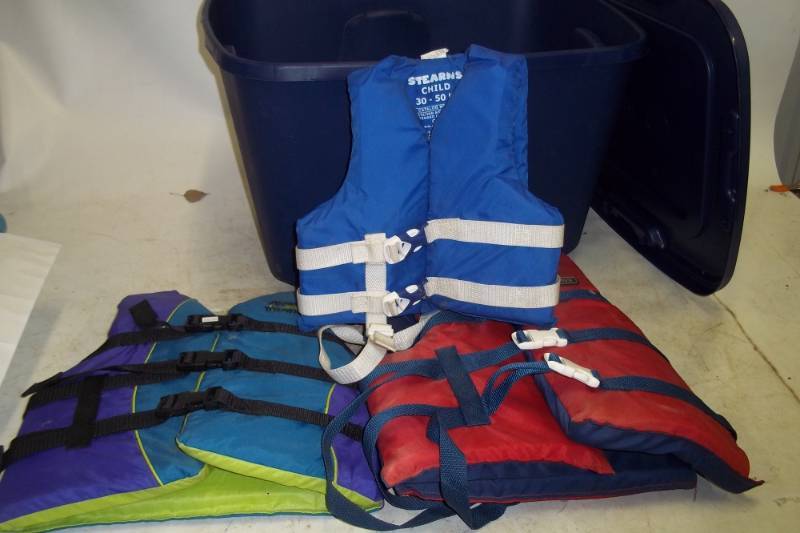 lot 248 image: Storage Tote with 3 Life Jackets