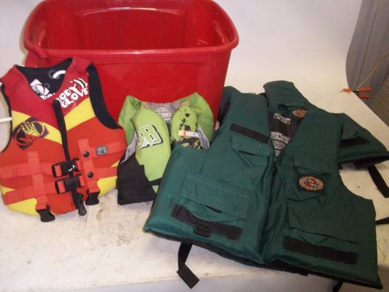lot 276 image: Storage Tote with 4 Life Jackets
