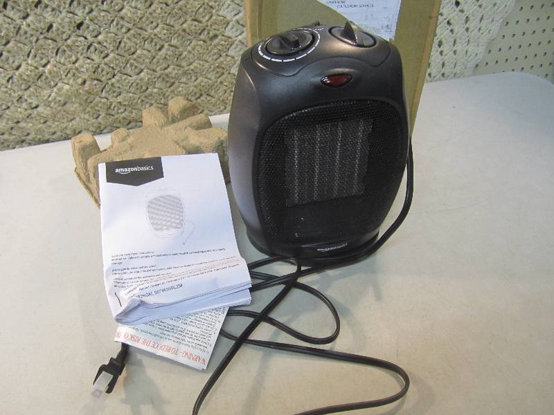 lot 27 image: Amazon Basics Oscillating Heater Te...