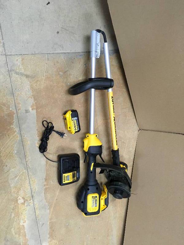 lot 64 image: DeWalt Electric Powered Straight Shaft Cordless String Trimmer 13 in. in like new condition