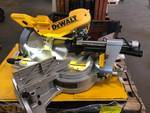 lot 67 image: DEWALT 15 Amp 12 in. Double Bevel Sliding Compound Miter Saw Model # DWS780 in like New conditions