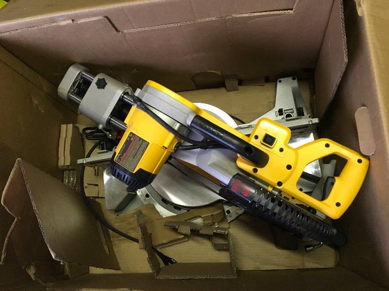 lot 44 image: Dewalt DWS779 15 Amp 12 in. Sliding Compound Miter Saw used in good condition
