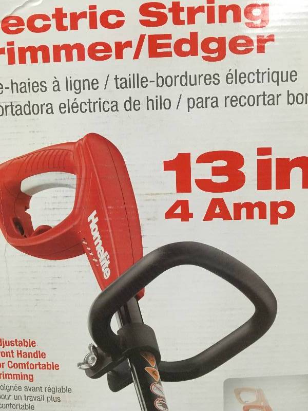lot 12 image: Homelite 13 In. 4 Amp Straight Electric String Trimmer Adjustable Length Durable used in working condition