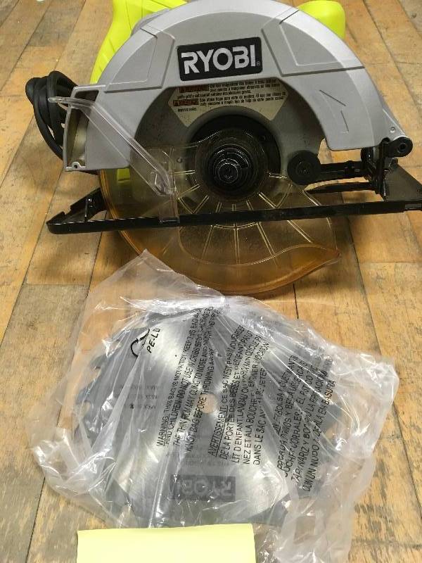 lot 23 image: Ryobi 13-Amp 7-14 in. Circular Saw open box like new conditions.