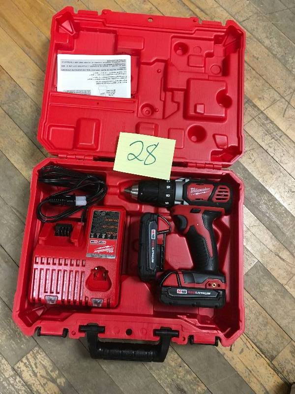 lot 28 image: Milwaukee M18 18-Volt Lithium-Ion Cordless 12 in. Drill Driver Kit W(2) 1.5Ah Batteries, Charger & Hard Case open box like New.