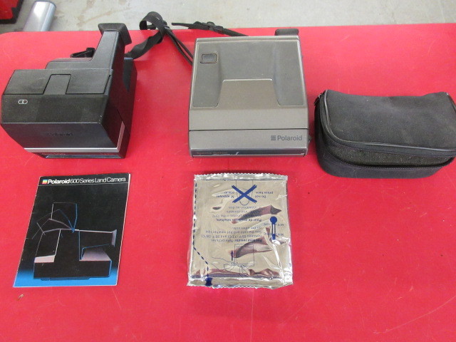 lot 335 image: TWO VINTAGE POLAROID CAMERAS